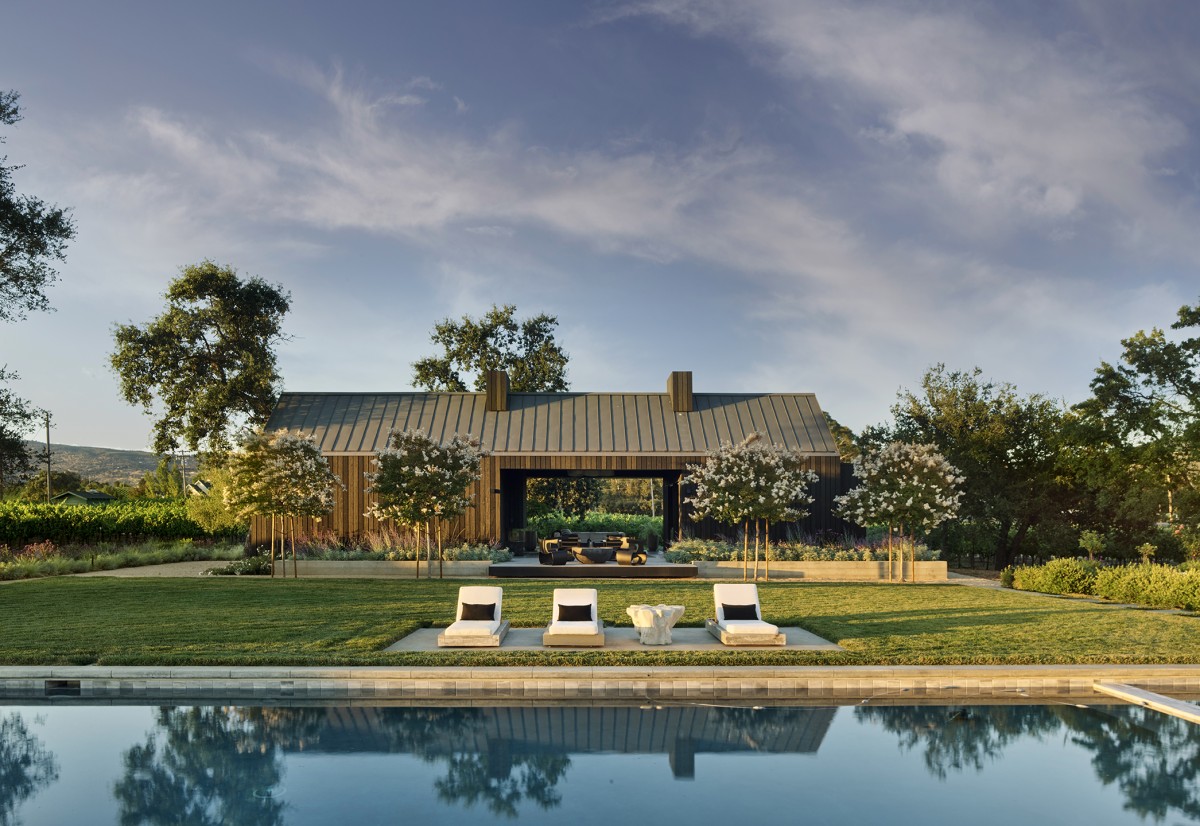 McKinley_03_Pool Illuminated estate landscape design with pool and lounge seating by Penning Landscapes.