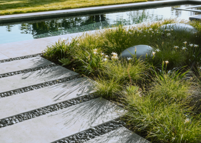 Seasonal planting and vegetable gardening near a pool in a Napa Valley estate garden.