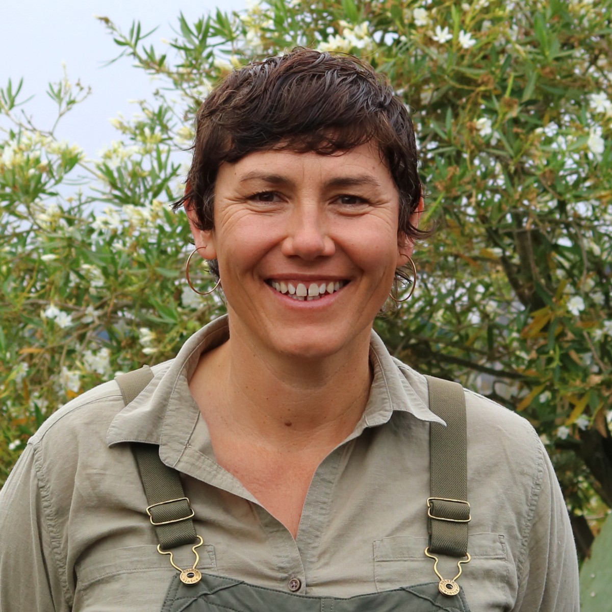 Gemme Von Knopka, Vegetable Garden Manager at Penning Landscapes, smiling in a garden setting.