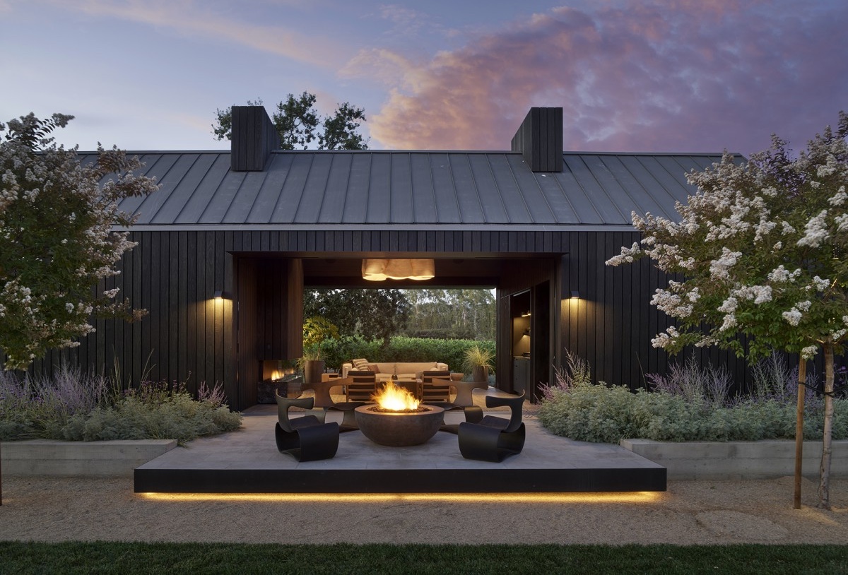 McKinley_01_Main-1 Architectural landscape lighting illuminating a winery building and outdoor entertaining area at dusk.