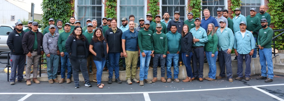 Penning Landscapes team members in company uniforms, showcasing grounds care professionals for Napa and Sonoma Valley estates.