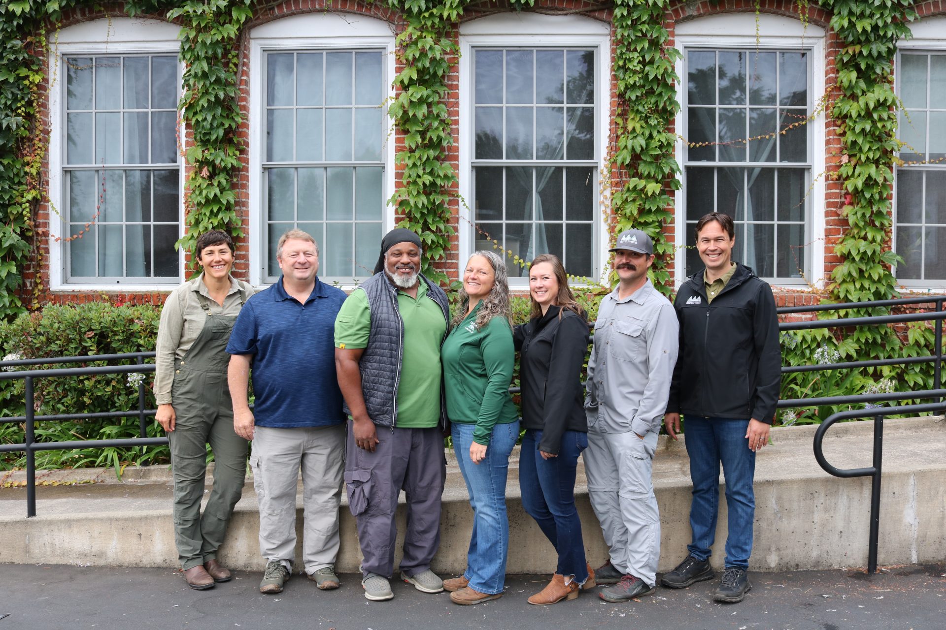 Penning Landscapes team members and garden experts showcasing plant health and resilience services.