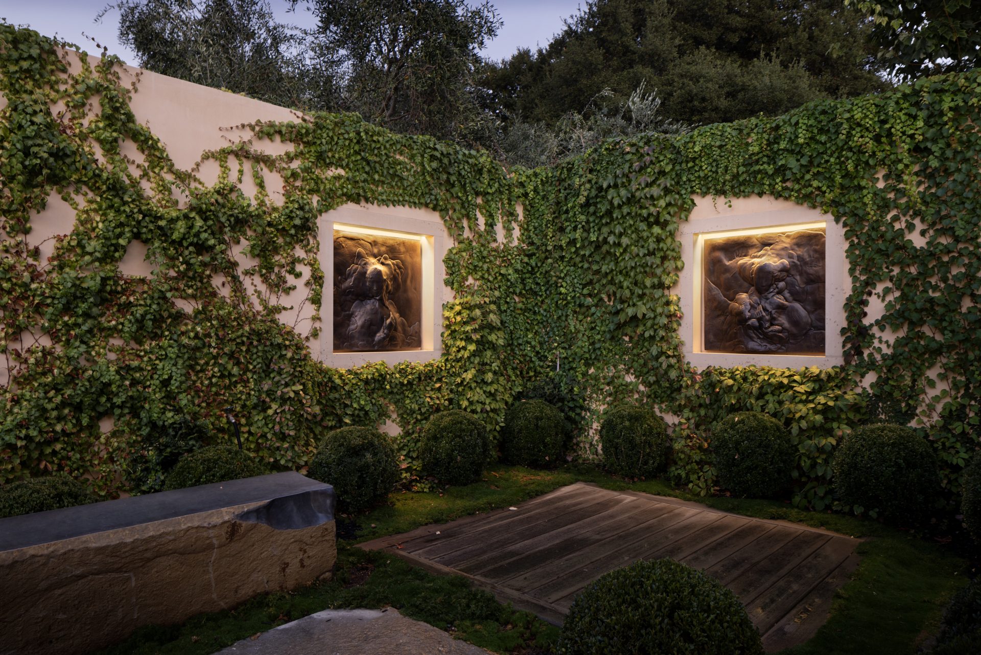 Hestia_07_Art Illuminated wall art and landscape lighting design in Napa Valley garden.
